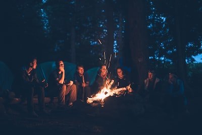 people around a camp fire telling a story